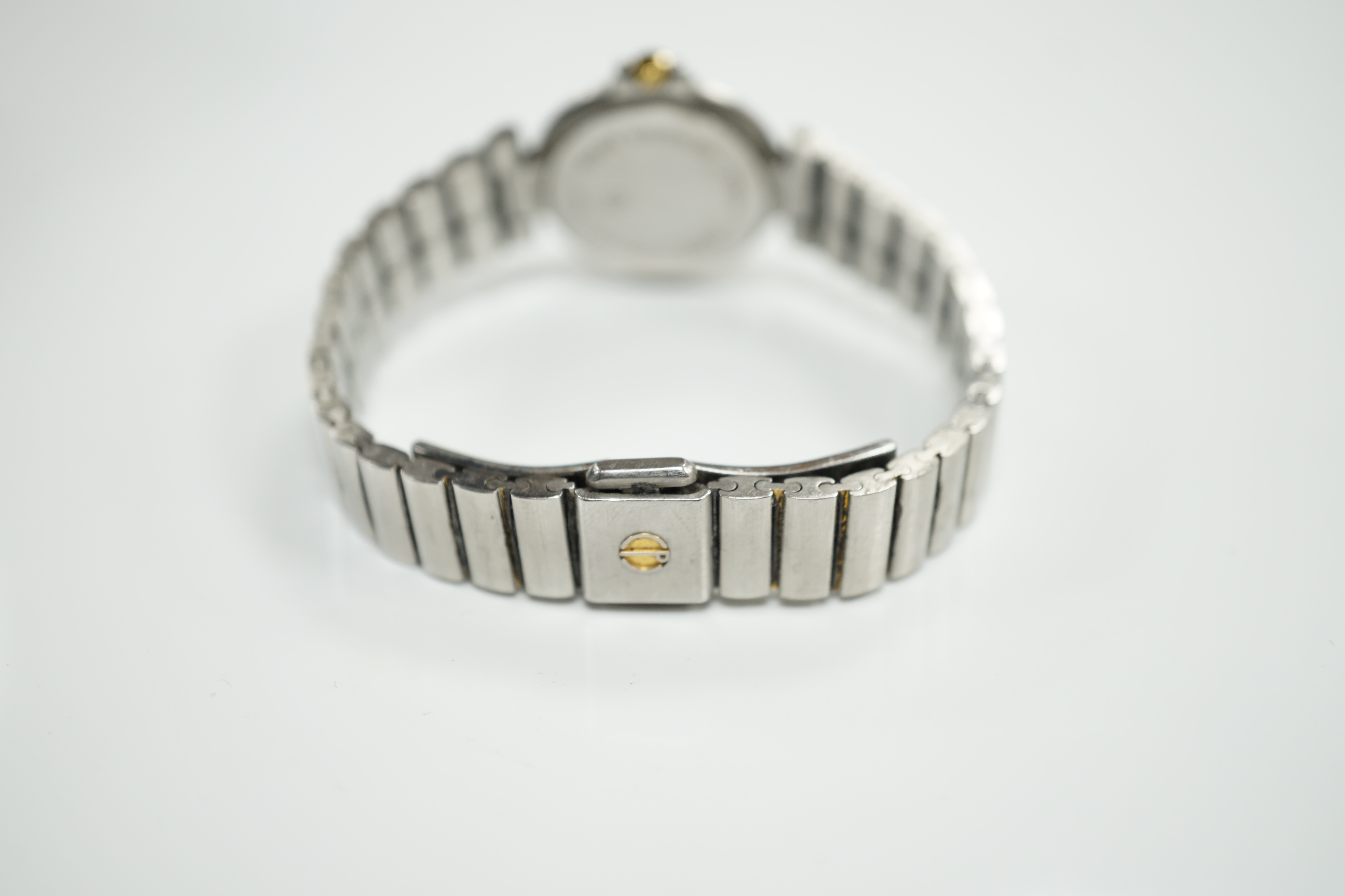 A lady's 1970's stainless steel Dunhill quartz wrist watch, with centre seconds and date aperture with box and papers.